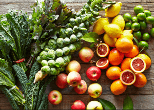 a group of fruits and vegetables on a wood surface Healthy Weight Loss Diets Swindon